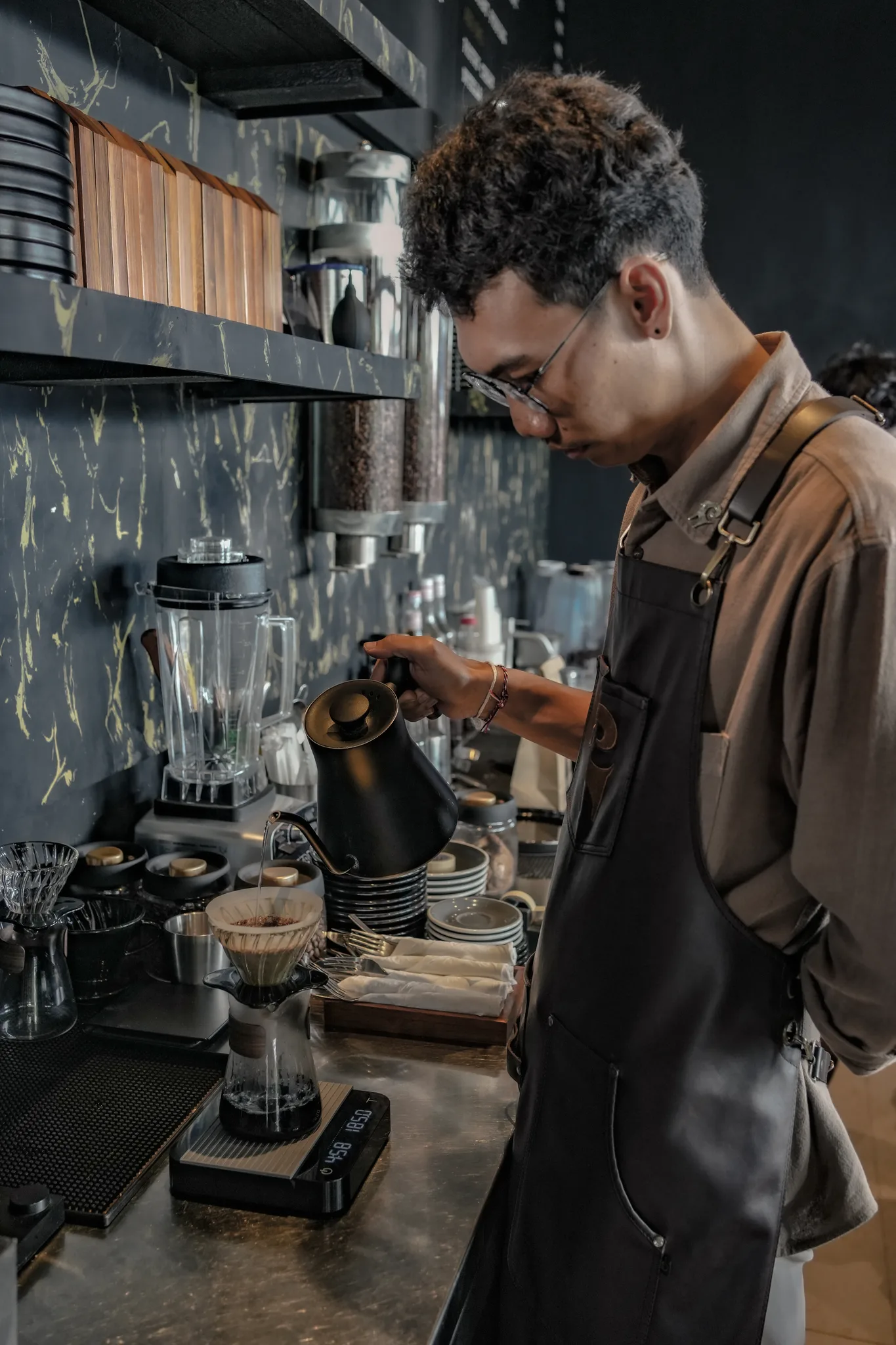 Barista pulling coffee at The Goat Father, Canggu