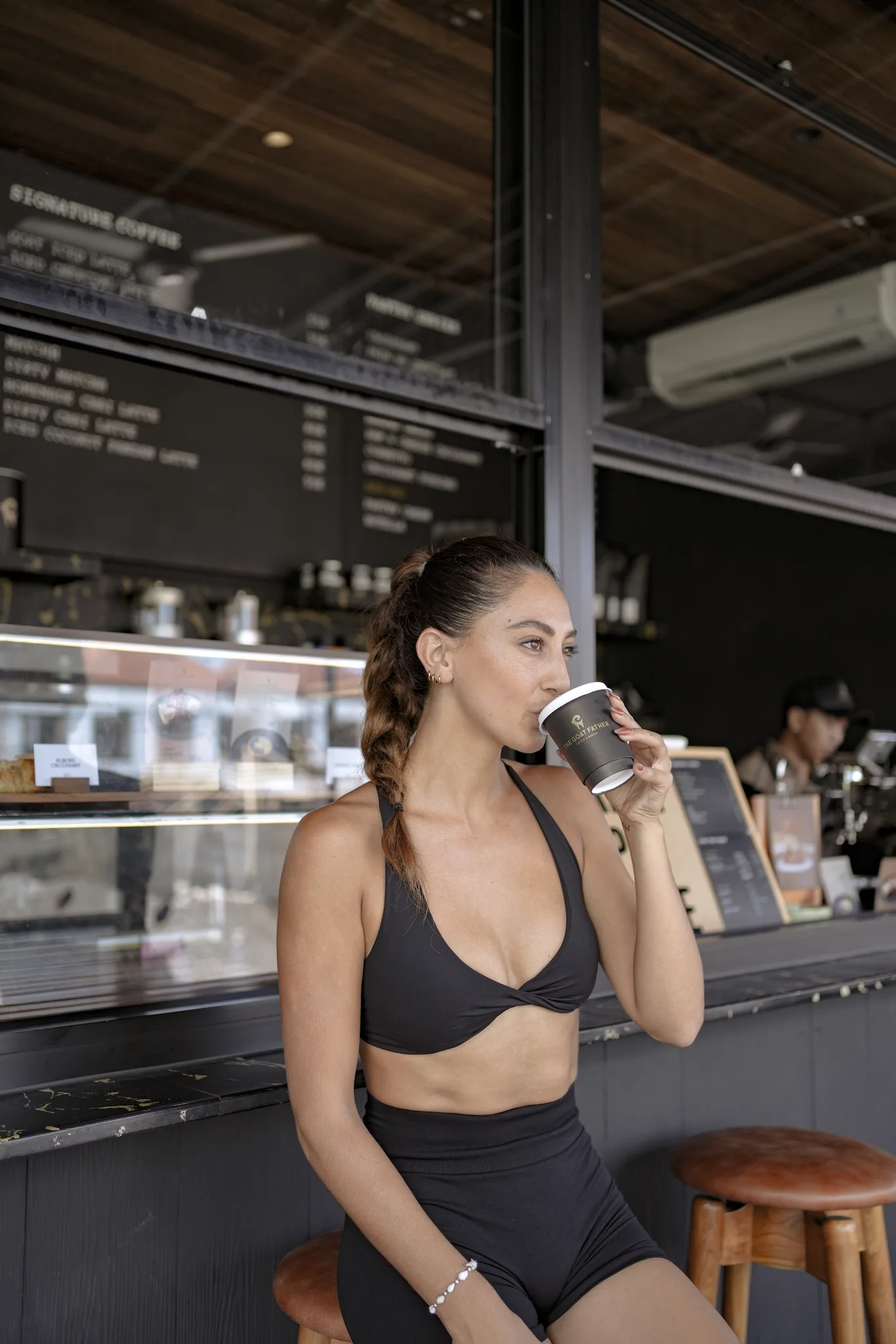 Guest enjoying coffee at The Goat Father counter, Canggu